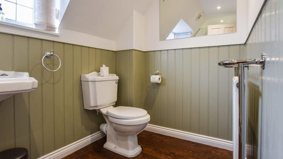 Beautiful panelling adorns the bathroom