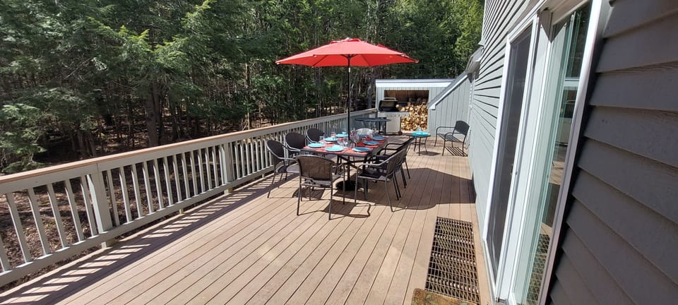 Large deck surrounded by forest