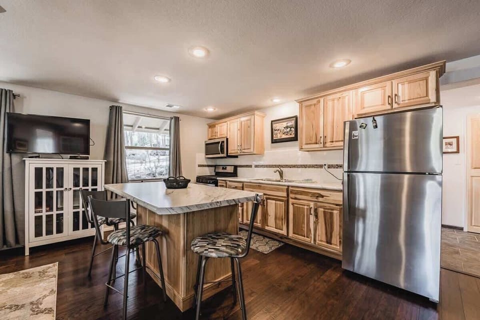 In the kitchen, you will find everything you need to cook a basic meal. Microwave, toaster, coffee maker, pots, pans, dishes, and utensils!
