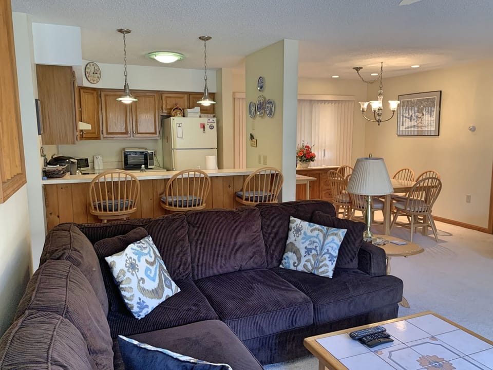 Living area towards dining area and kitchen