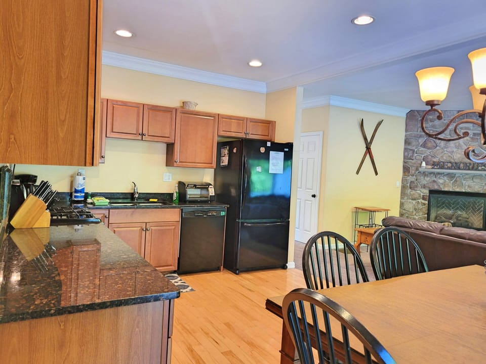 Dining area and kitchen towards entry hall