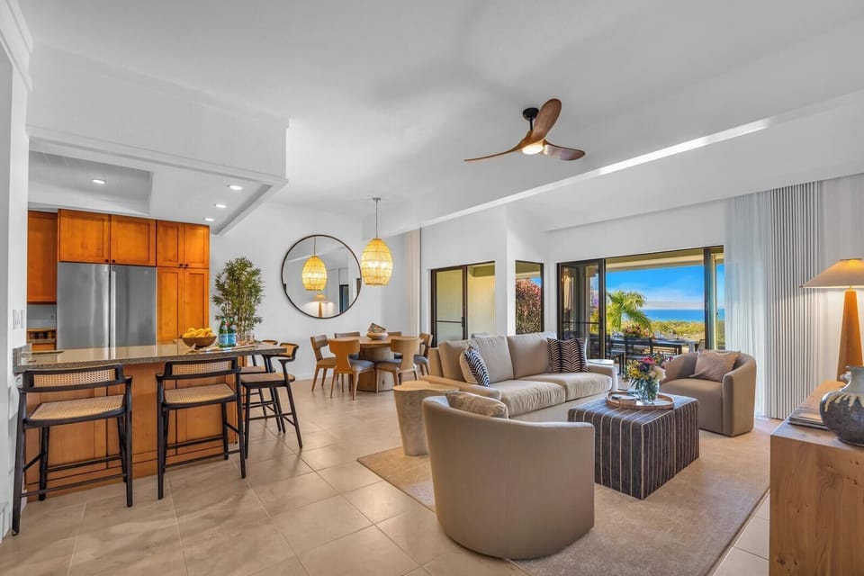 An open layout connects the living area, dining space, and kitchen for easy gathering and conversation.