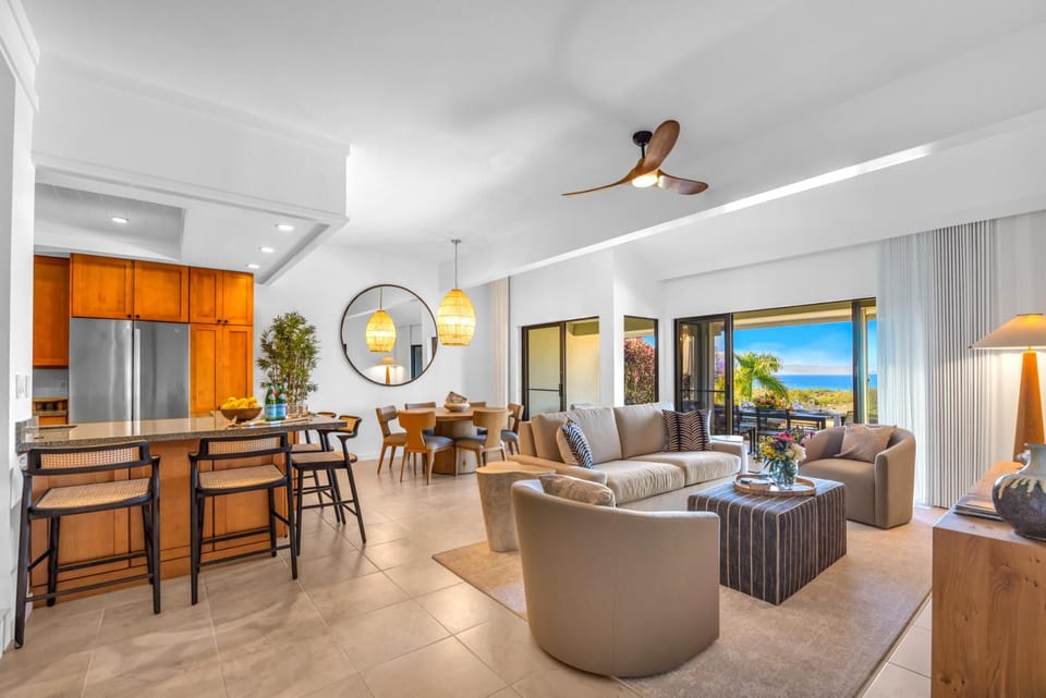 An open layout connects the living area, dining space, and kitchen for easy gathering and conversation.
