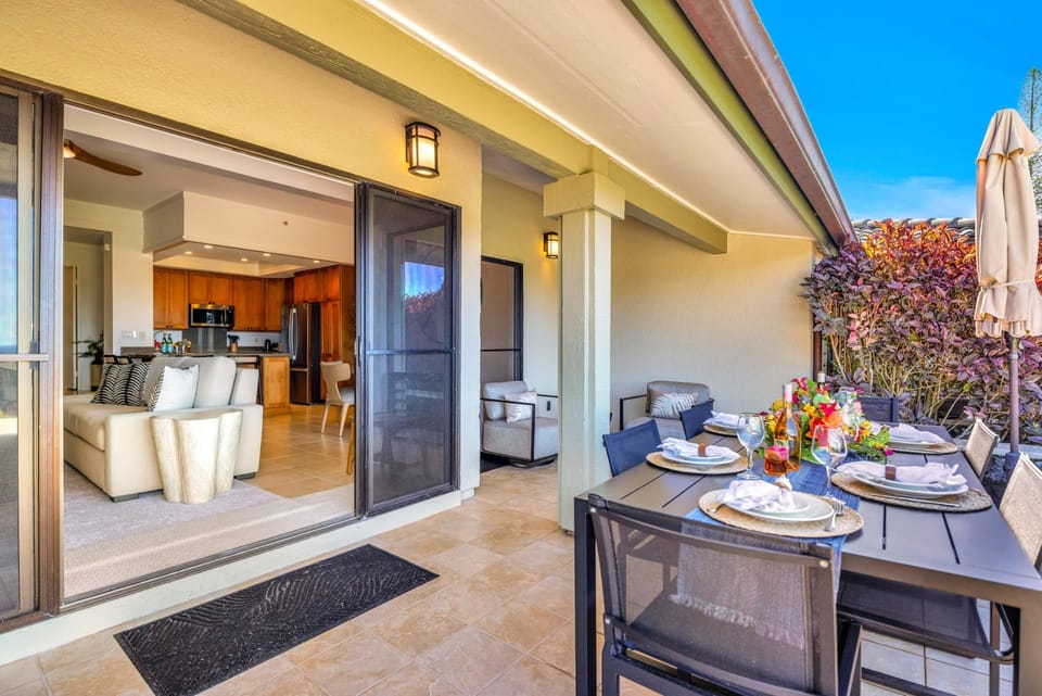 Indoor-outdoor living flows easily from the living area onto the lanai with dining space and resort views.