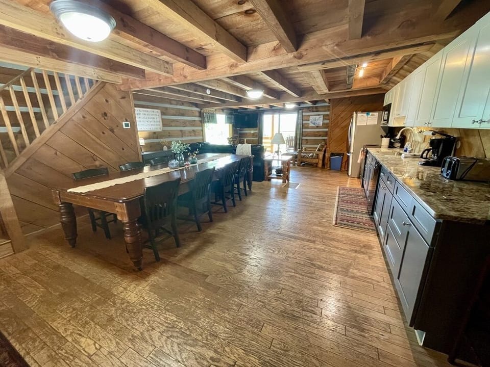 Main level Kitchen/Dining area leading to living room and back porch