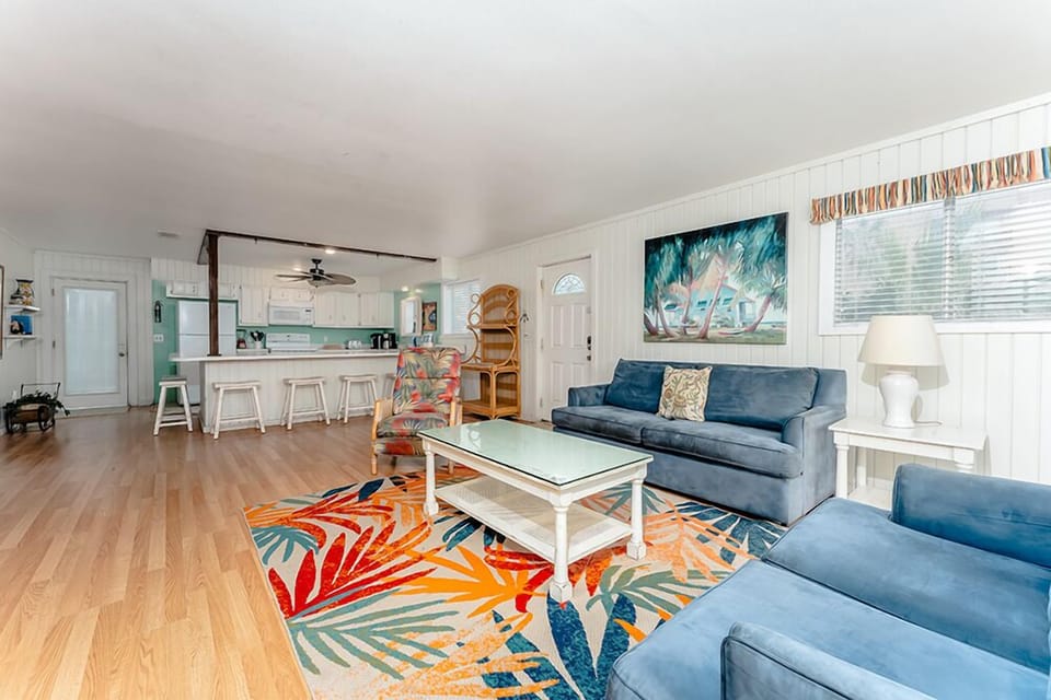 The 2nd floor has two bedrooms, two bathrooms, a living room, a kitchen, and a balcony that overlooks the private pool.