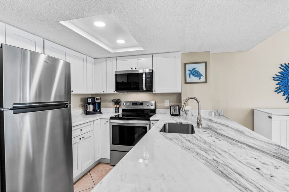 Your fully equipped kitchen features gleaming granite counters, stainless appliances, and everything you need to create delicious meals during your stay.