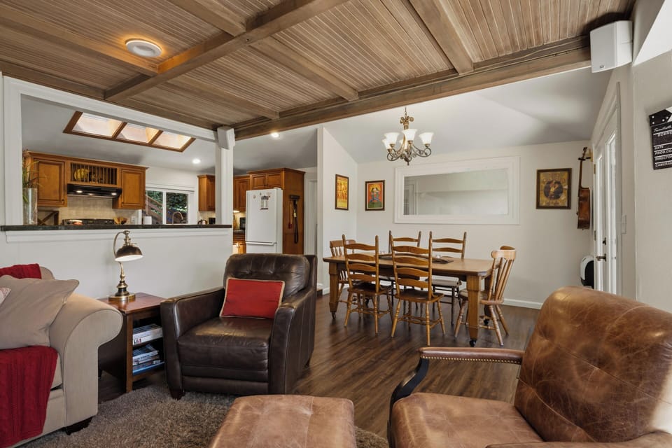 The open floorplan upstairs encourages free flowing conversation from the kitchen to the dining and living areas.