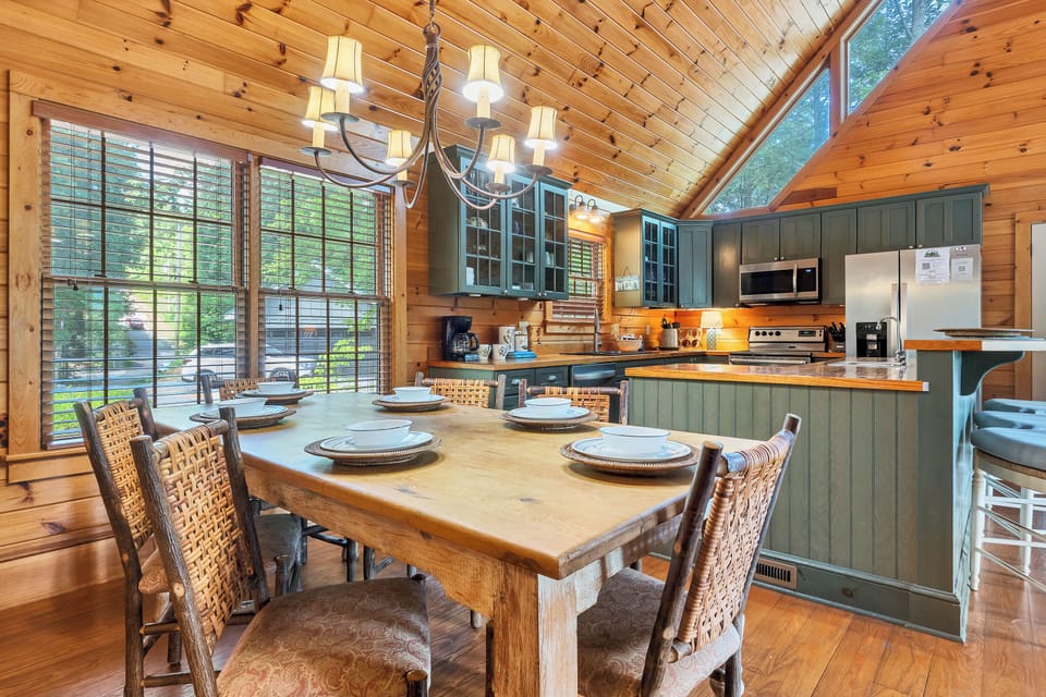 Dining table for six guests plus 3 at the bar.