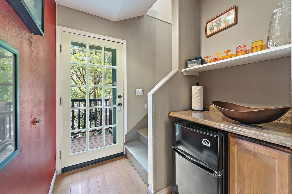 Back door on the middle level leads directly to the outside stairs to hot tub or the inside stairs to the upper level.