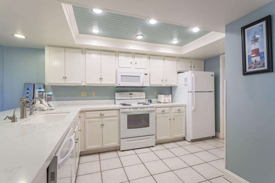 Our kitchen is flooded with beachfront light from our large windows.