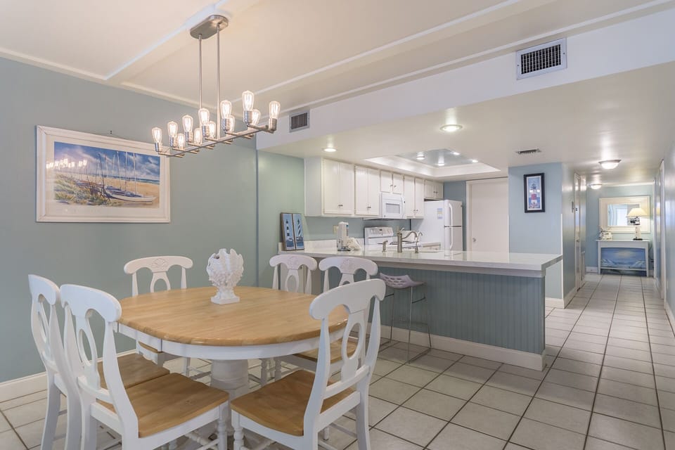 There are 4 seats around our table and 1 stool at the breakfast bar.