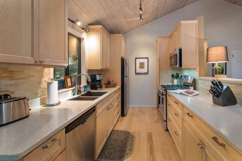 Recently remodeled kitchen faces the back deck.