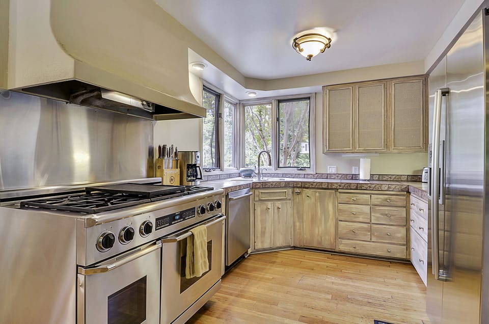 Dacor professional double oven stove in the fully stocked kitchen.
