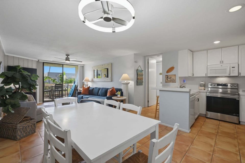 The open-concept dining area is perfectly situated between the kitchen and living room for entertaining or family game nights