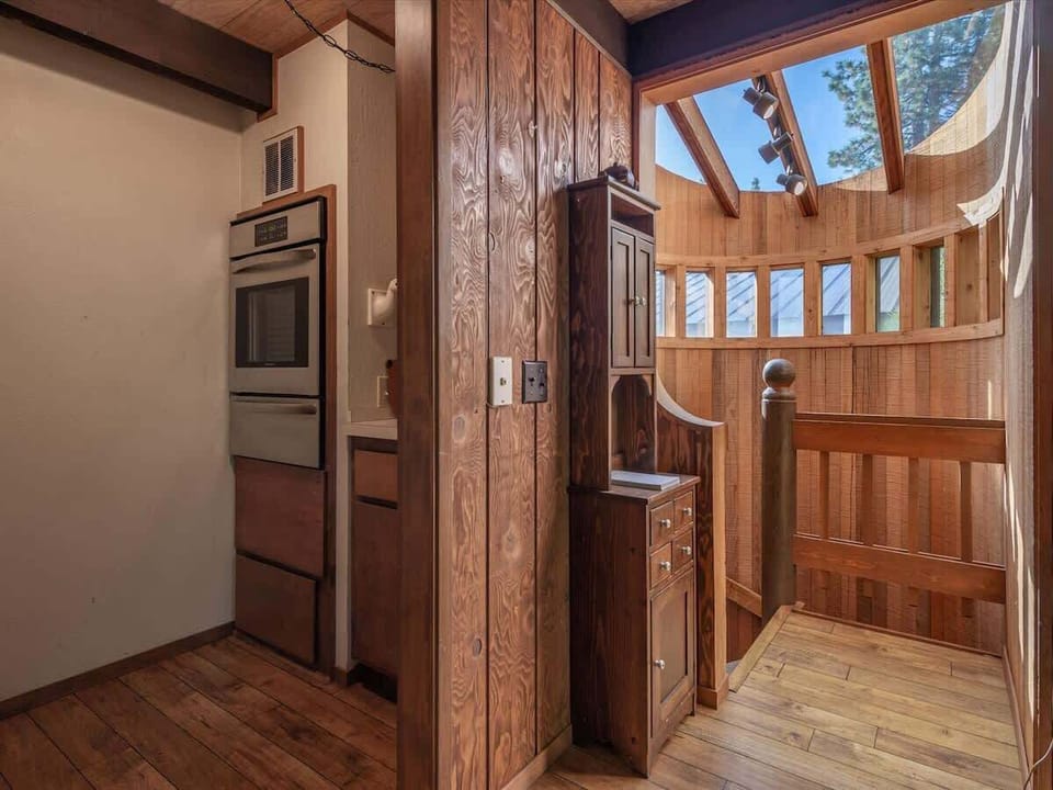 Top of the spiral staircase brings you to the middle level of home and pantry area with new oven.