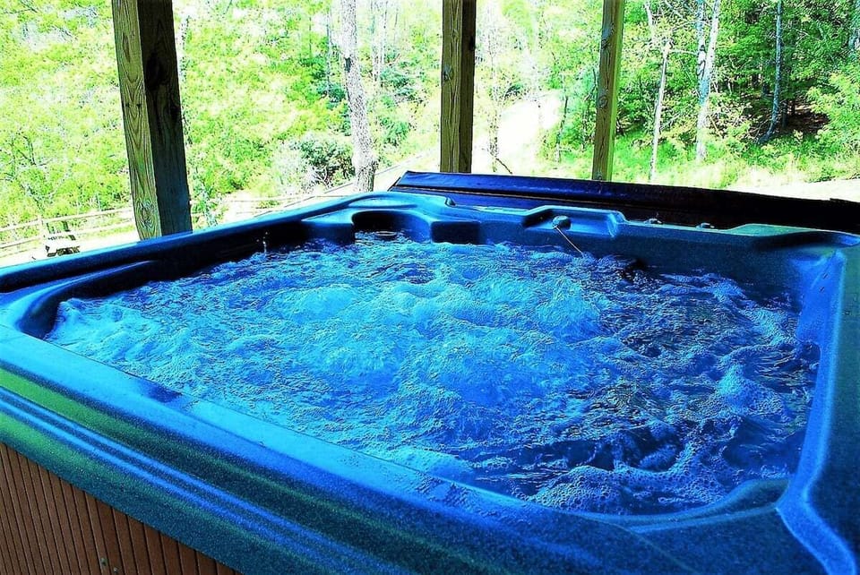 Relaxing hot tub with mountain and river views