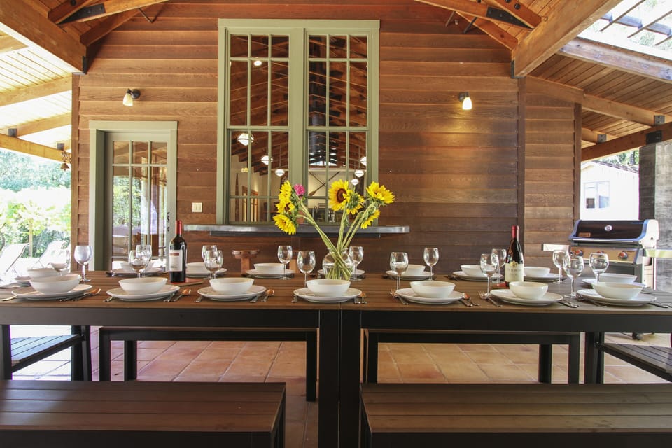 Covered outdoor dining at the Pool House.