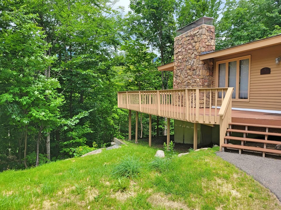 Grassy side yard and deck
