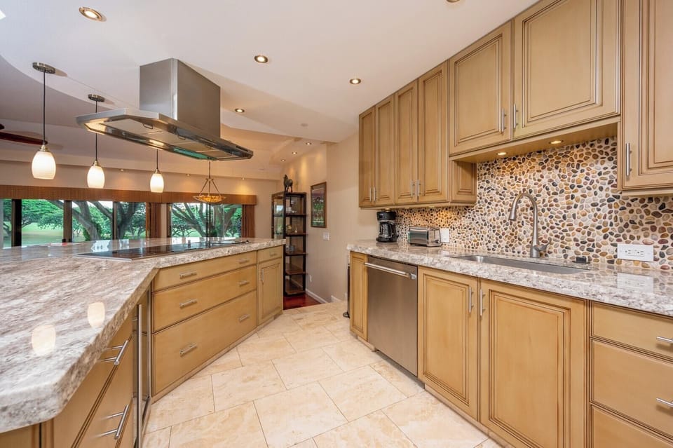 This gourmet kitchen features luxe countertops, custom cabinetry, and modern appliances—ready for any culinary adventure    