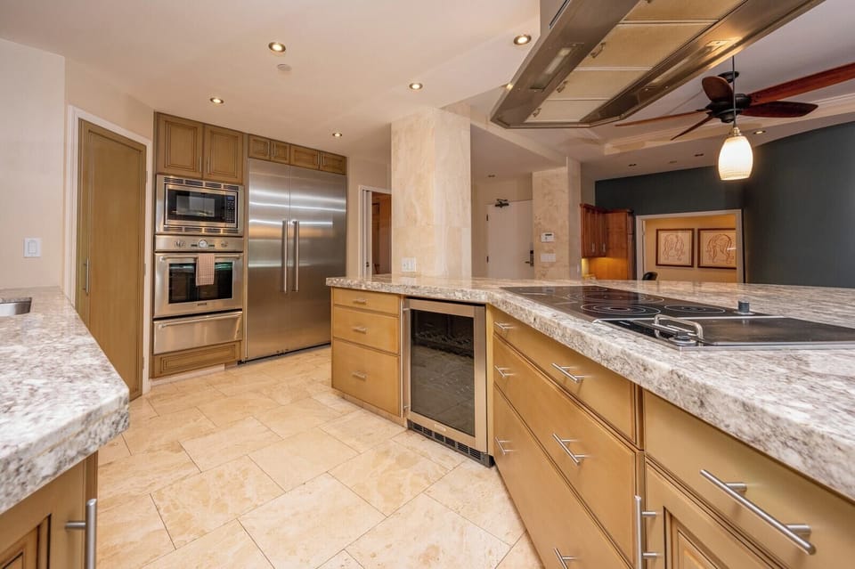 With warm tones, a sleek backsplash, and pro-grade appliances, this kitchen blends beauty and function in every detail    