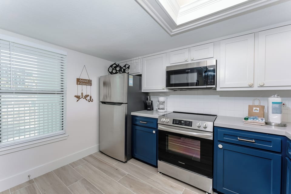 We have recently updated our kitchen with our guests in mind. The stainless-steel appliances and deep blue cabinetry enhance the space.