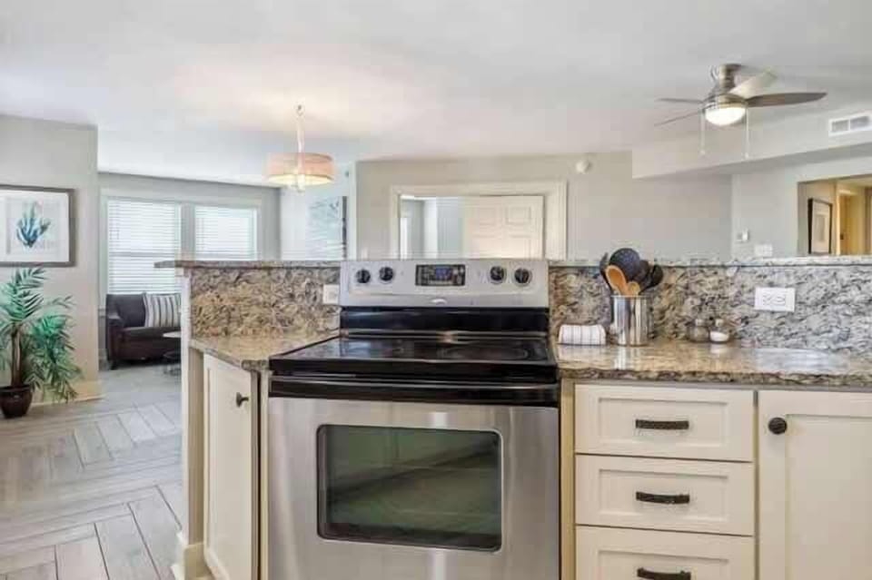 The kitchen bar looks over the entire living space. So open & bright!