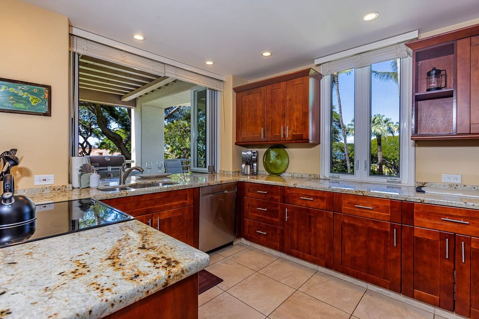 Kitchen features a pass through window to the lanai