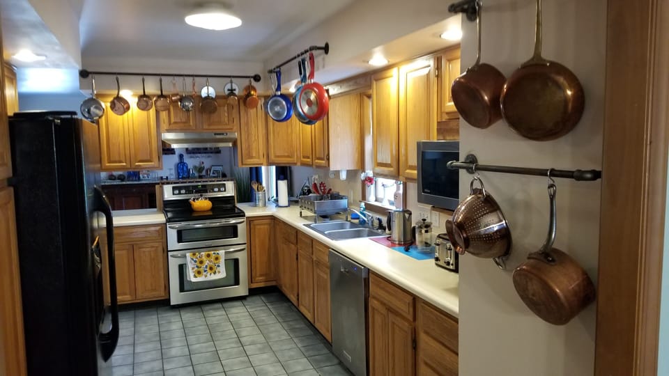 Kitchen - Electric Stove Microwave, Dishwasher, Toasters, Coffee, Tea.