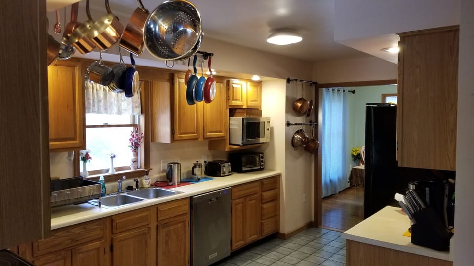 Kitchen - Electric Stove Microwave, Dishwasher, Toasters, Coffee, Tea.