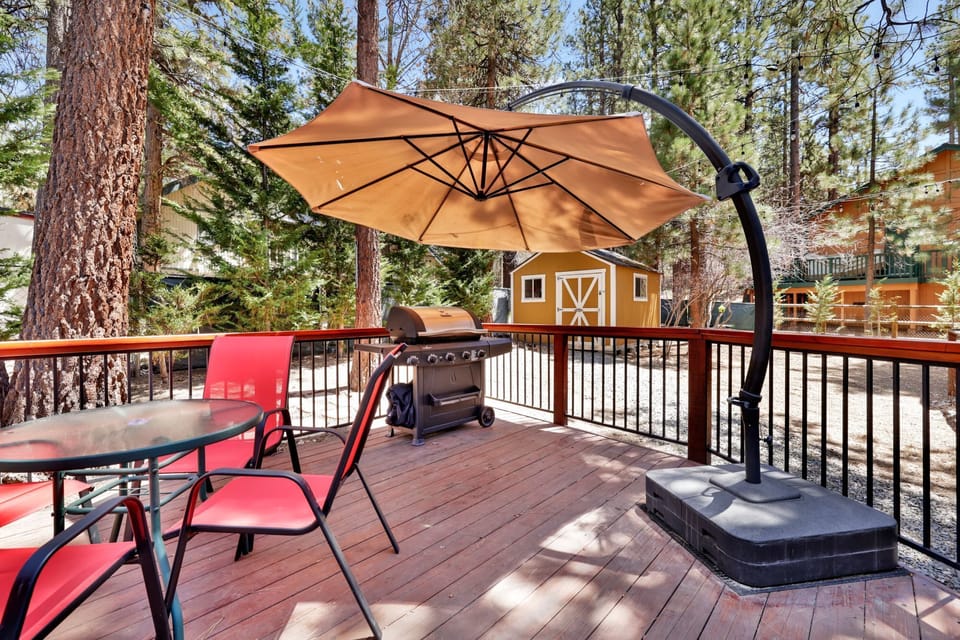 Private outdoor deck, surrounded by tall pines, perfect for relaxing under the trees after a day of adventure—enjoy peaceful forest views, fresh air, and a truly rejuvenating stay.