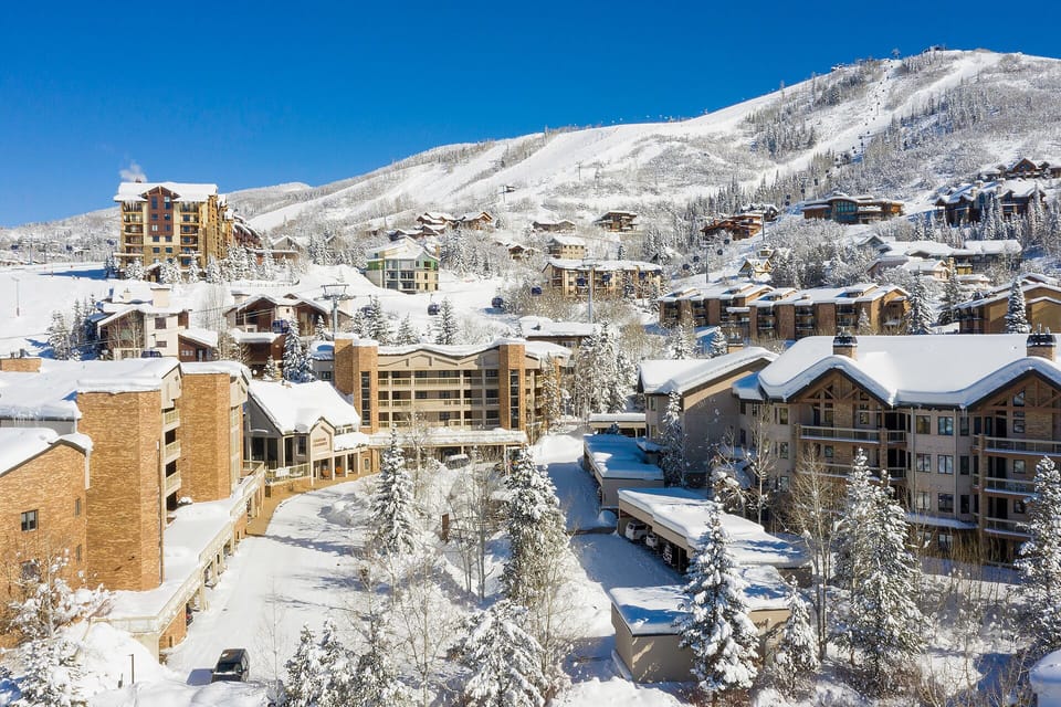 The property is nestled in a picturesque winter mountain village, surrounded by snow-covered slopes and alpine charm.