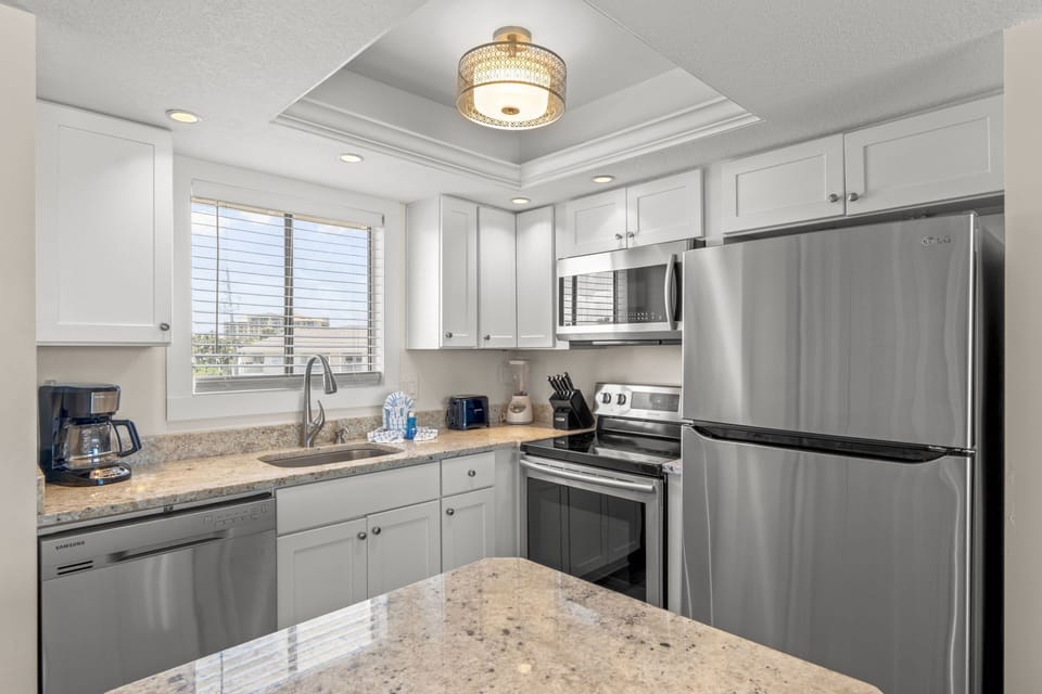 Your fully equipped kitchen features granite countertops, stainless steel appliances, and everything you need to create memorable meals during your stay.