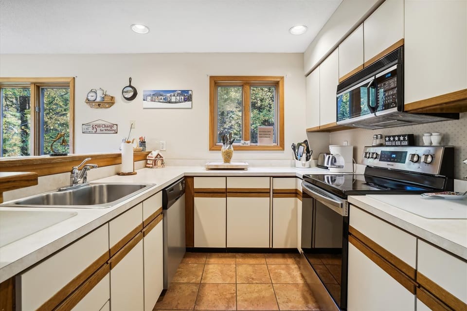 Bright kitchen with plenty of counter space.  Lots of natural lighting