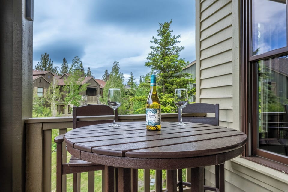 Picture yourself relaxing on your private balcony with a glass of wine, surrounded by lush greenery and peaceful mountain views—your perfect retreat awaits.