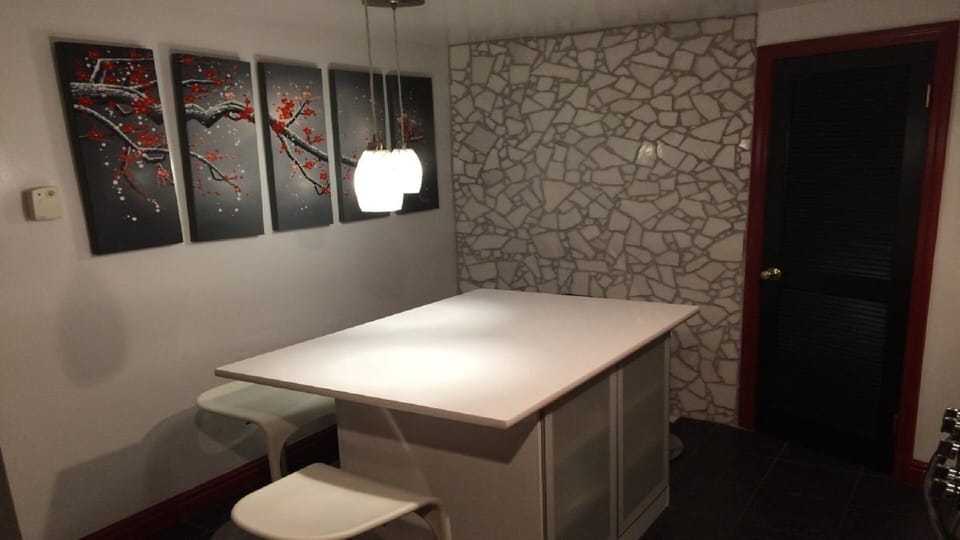Fully equipped modern kitchen with white quartz countertop, SS applicances 