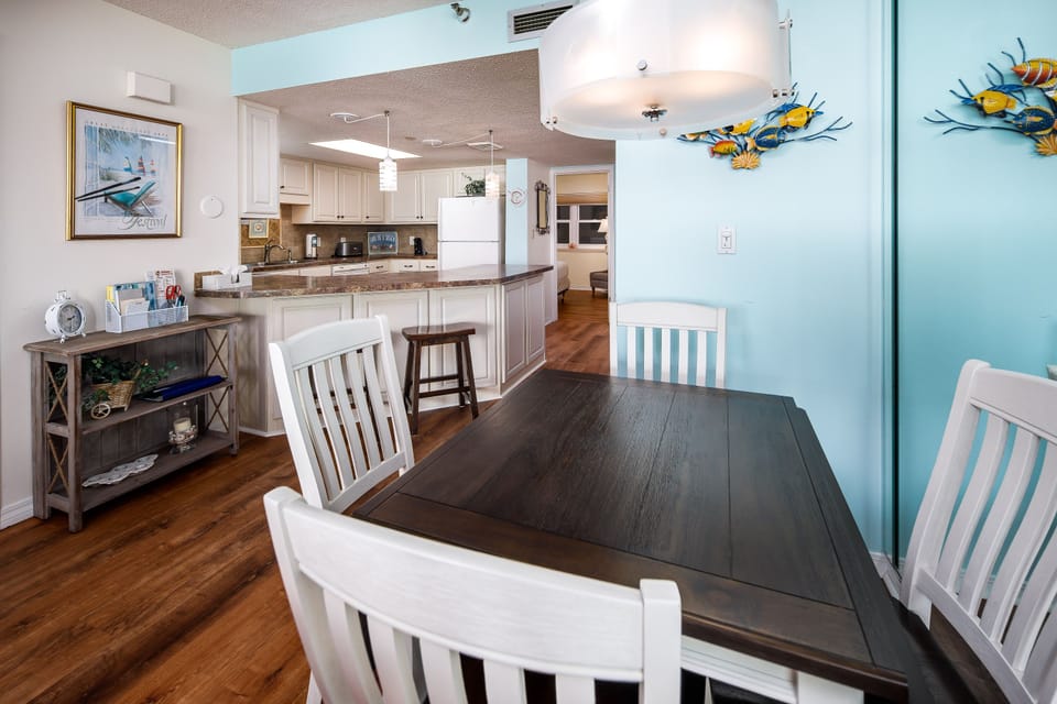 Dining area seats 4 with 2 bar stools