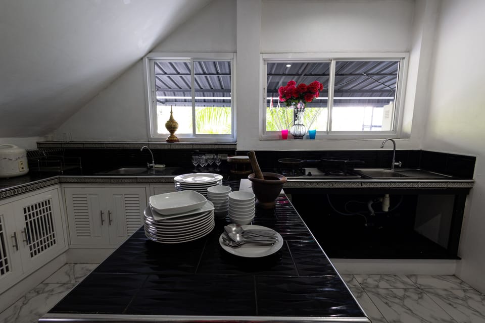 Kitchen room with Gas cooker and kitchenware 