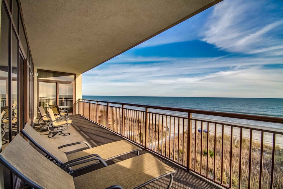 Oversized oceanfront balcony with panoramic Atlantic views and plenty of room to relax.