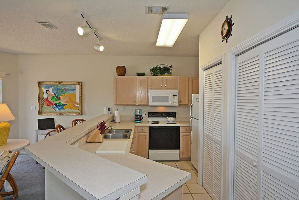 Your fully equipped kitchen features sleek countertops, modern appliances, and ample storage for memorable meals together.