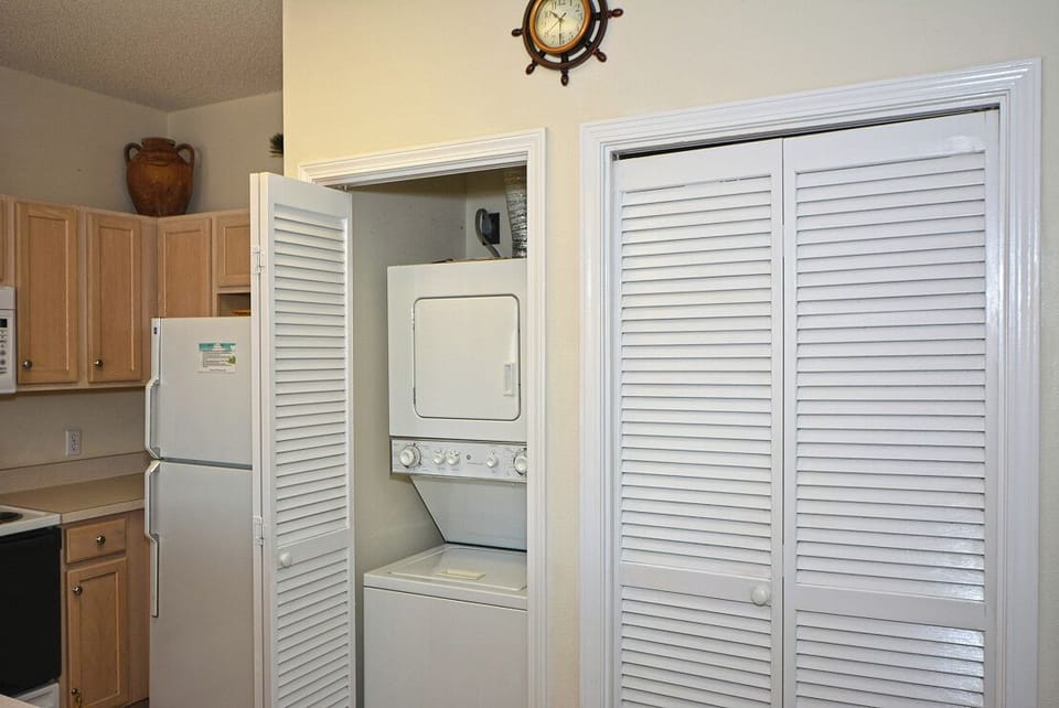 Your in-unit washer and dryer are tucked behind elegant louvered doors, keeping your laundry conveniently private.