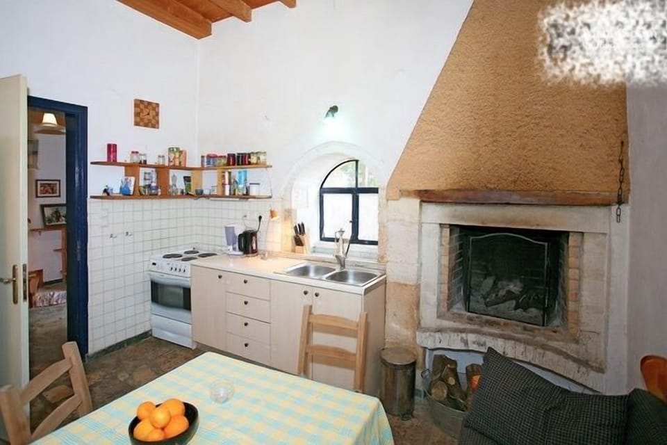 kitchen with stone floor and fireplace 1