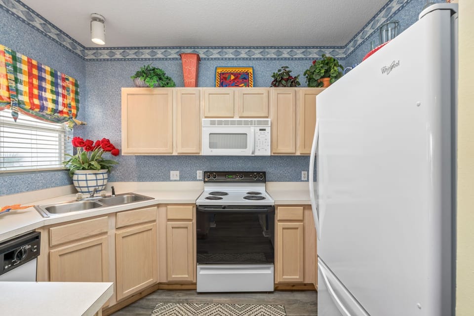 Your fully equipped kitchen features modern appliances and cheerful décor, perfect for preparing your favorite meals during your stay.