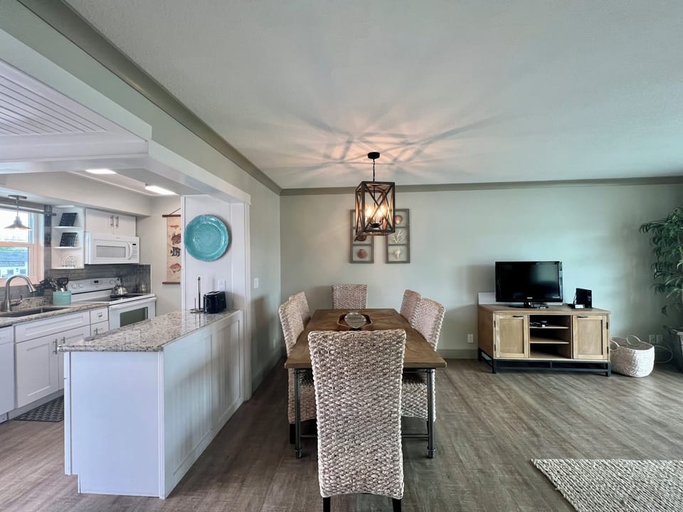 Gather around your spacious dining table for memorable meals, with the open kitchen making cooking and entertaining effortless.