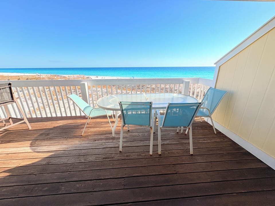 Step onto your private deck where ocean breezes meet comfortable seating. Sip morning coffee while watching waves dance across pristine turquoise waters.
