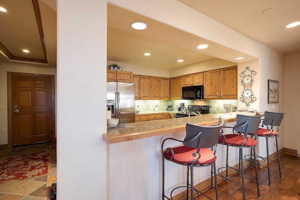 Your spacious kitchen features granite counters and bar seating where you can enjoy morning coffee or casual meals together.