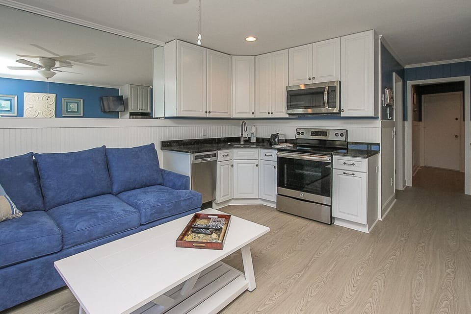 Seaside Villas - 232 - Living Room / Kitchen Area - The sleeper sofa in the living room makes room for extra company.