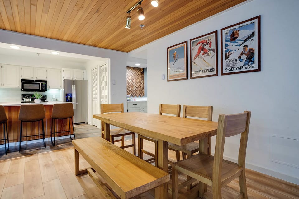 Gather around this beautiful wooden dining table where your group can share meals and plan adventures together.
