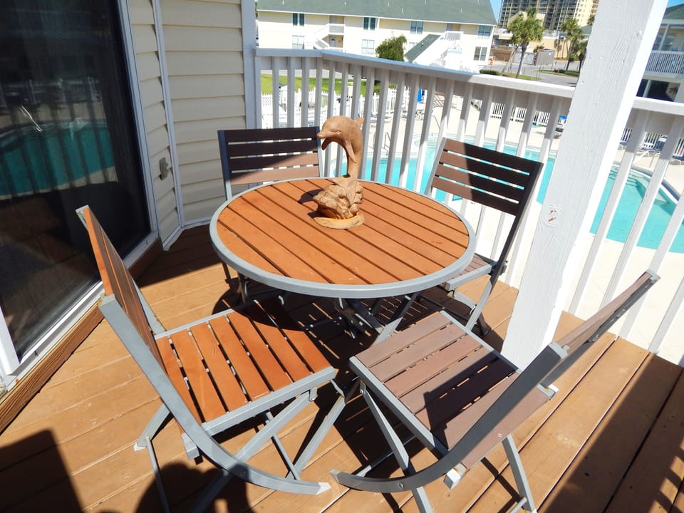 Start your day with coffee on your private balcony, overlooking the sparkling pool below while soaking up the morning sunshine.