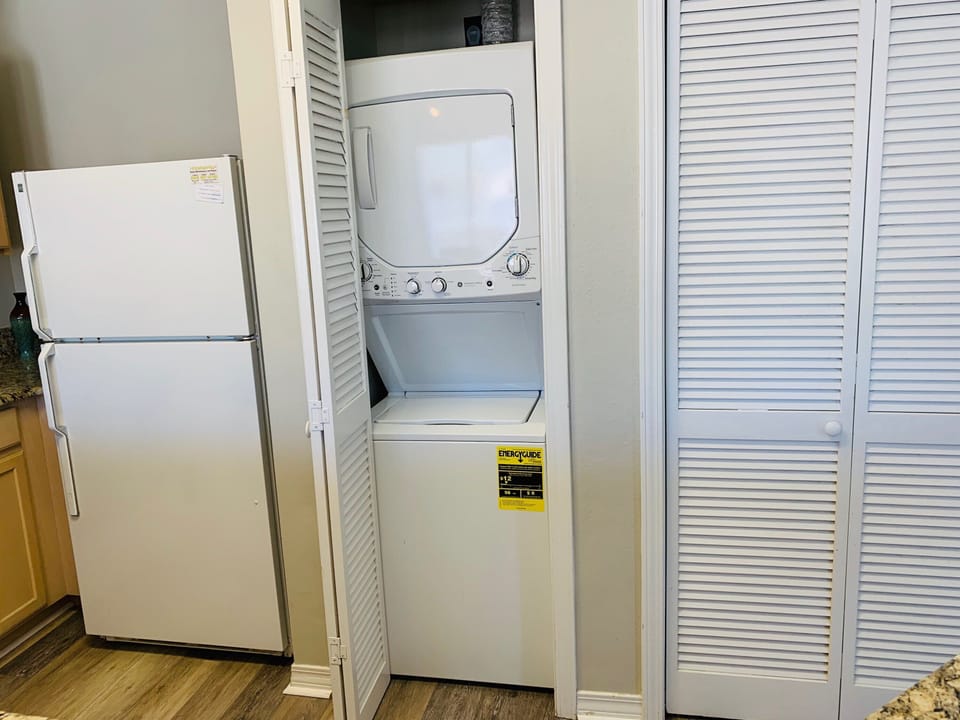 Your laundry needs are covered with an in-unit stackable washer and dryer tucked neatly behind stylish folding doors.